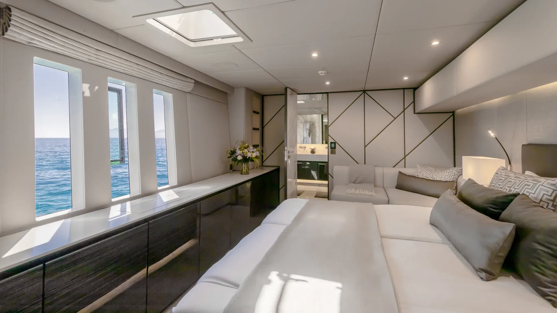 Forward starboard guest cabin in grey oak and anegre aboard the Sunreef 80 catamaran