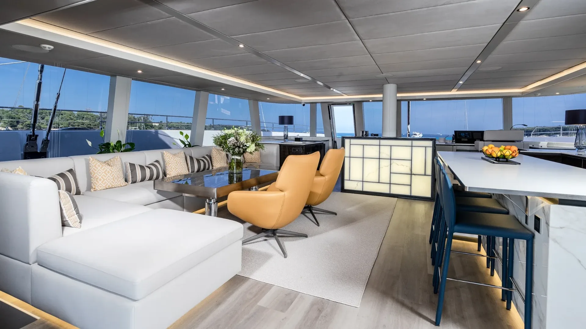Wide view of the salon looking through to the galley bar and island seating
