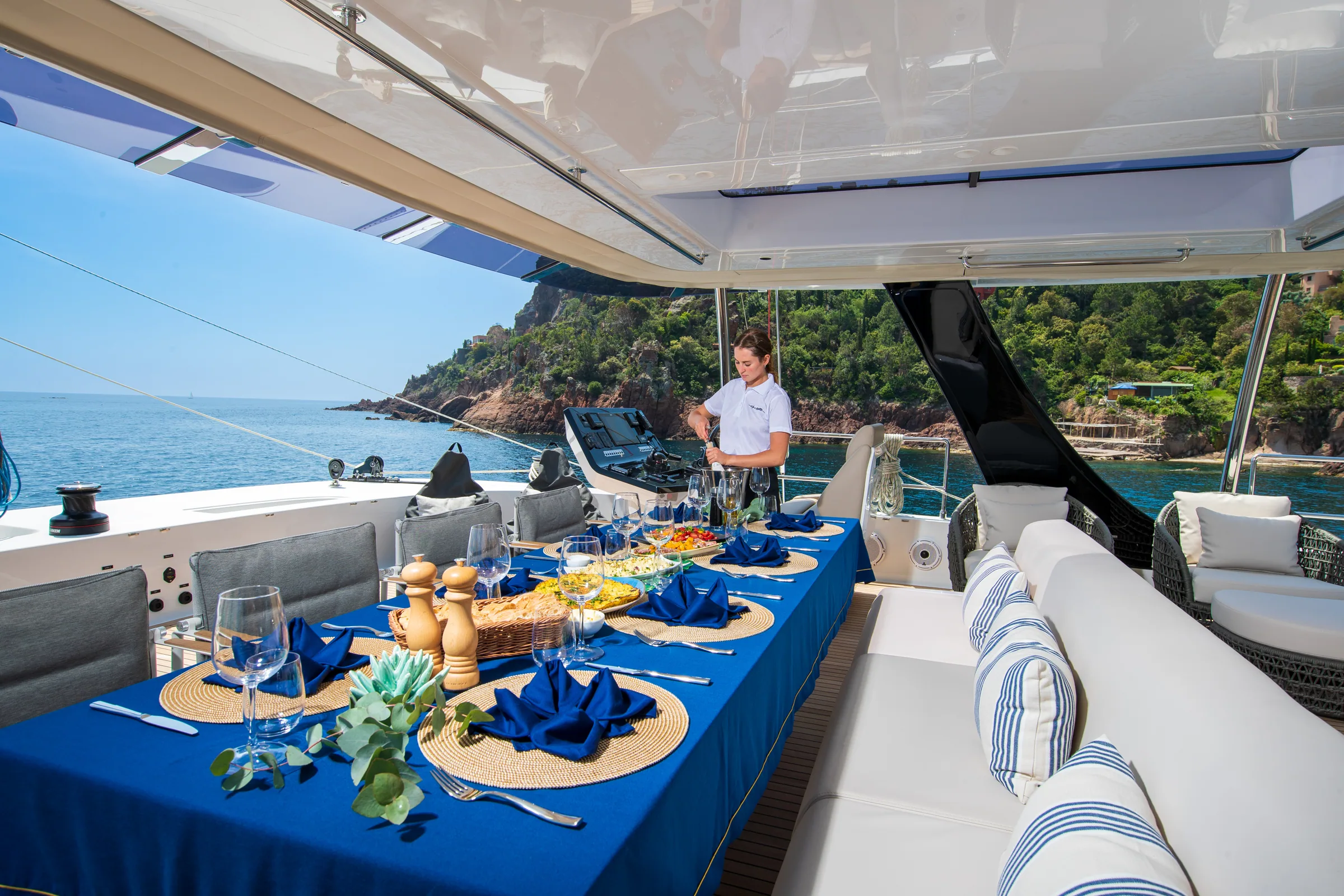 Cockpit table set for dinner aboard Endless Horizon II with the sun low on the horizon