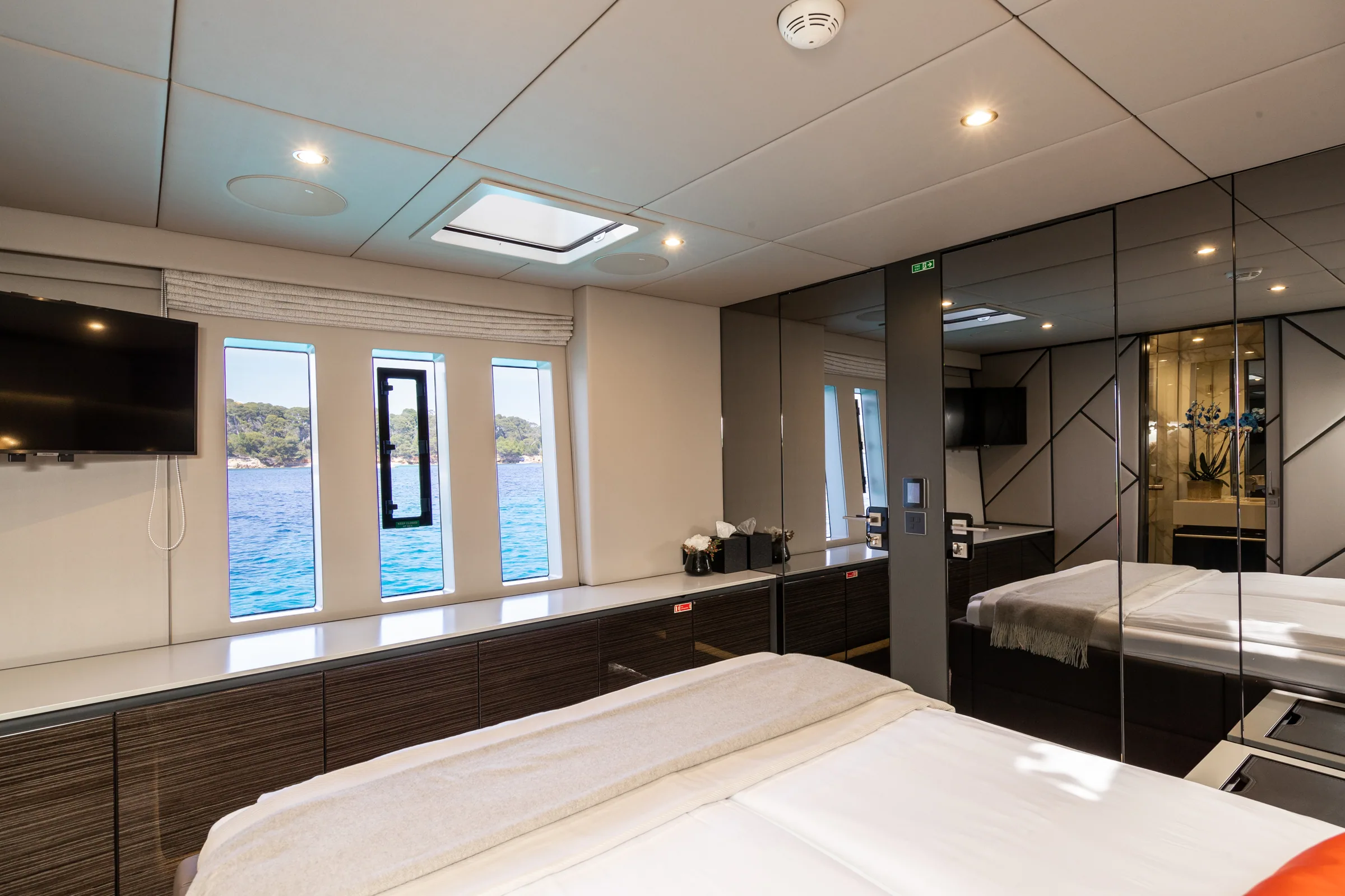 Forward port guest cabin with an overhead hatch skyscreen aboard Endless Horizon II